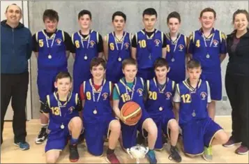  ??  ?? Coláiste Bhríde first year boys basketball team with teachers John King and Elisabeth Dermody.