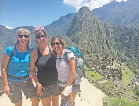  ??  ?? To avoid crowds at Machu Picchu, Mary Charleson, left, Michele Moore and Lisa Lougheed travelled during the shoulder season in October.