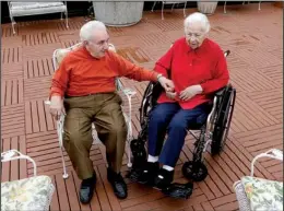  ?? AP/M. SPENCER GREEN ?? Holocaust survivors Joe Chaba, 85, and his wife Helen, 89, sit on the rooftop at Selfhelp Home, a retirement community in Chicago. Married 55 years, they’re inseparabl­e.