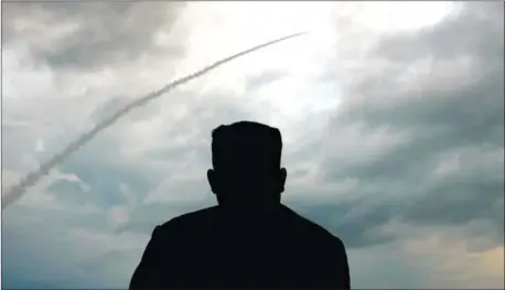  ?? KCTV/AFP ?? North Korean leader Kim Jong-un watches the launch of a ballistic missile at an unknown location in North Korea early on July 31.