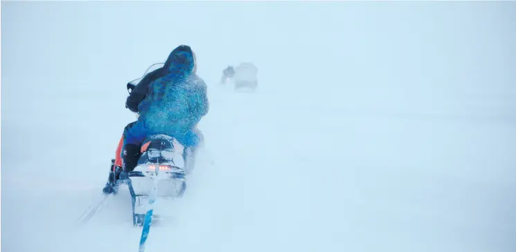  ?? PHOTOS: JONATHAN FRANTZ ?? Led by elders Michelline and Samueli, the Ammaaq family leaves Igloolik to retrieve their cache of igunaq — fermented walrus — which was carefully prepared and buried in the summer. “Igloolik has the right kind of rocks, so the meat doesn’t over-rot,”...