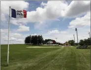  ?? AP FILE ?? An Iowa state flag flies on June 5 on the Dyersville, Iowa, baseball field where the 1989 move ‘Field of Dreams’ was filmed. A new 8,000-seat stadium being built adjacent to the site is to host an Aug. 13 game between the St. Louis Cardinals and Chicago White Sox. The game originally was supposed to pit the New York Yankees against the White Sox.