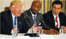  ?? ASSOCIATED PRESS FILE PHOTO ?? President Donald Trump, left, speaks during a meeting with manufactur­ing executives at the White House in Washington, including Merck CEO Kenneth Frazier, center, and Ford CEO Mark Fields.