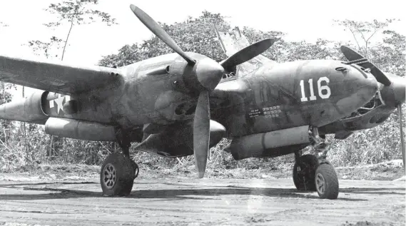  ??  ?? P-38H no.116 of the 431st Fighter Squadron sits in its revetment at North Borioa Airstrip at Dobodura, New Guinea, during November 1943. No.116 was assigned to five-kill ace, Second
Lt. John Tilley, but was flown by a number of other 431st FS pilots, who scored at least 14 kills while flying her.