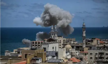  ?? Photograph: Mohammed Saber/EPA ?? Smoke rises over a mosque in Gaza City after an Israeli airstrike on Monday.