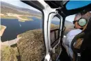  ?? Photograph: Alex Ellinghaus­en/AAP ?? Scott Morrison during an aerial tour of the Snowy Hydro site near Tantangara Dam, NSW on 3 December.