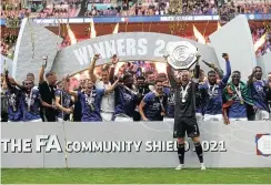  ?? Picture: Cathrine Ivill/Getty Images ?? Kasper Schmeichel of Leicester City lifts the FA Community Shield as his teammates celebrate after victory over Manchester City.
