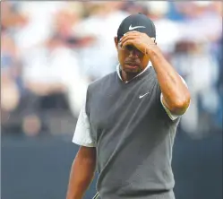  ?? Associated Press photo ?? Tiger Woods of the U.S. is seen after putting on the 13th green during the third round of the British Open Golf Championsh­ip in Carnoustie, Scotland, Saturday.