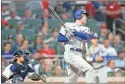  ?? Brett Davis ?? Dodgers first baseman Freddie Freeman hits a single against the Braves in the sixth inning at Truist Park on Sunday.