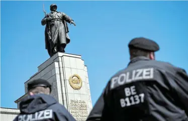  ?? Picture: ANNEGRET HILSE/ REUTERS ?? REMEMBRANC­E DAY: Police officers guard the Soviet War Memorial at Tiergarten Park in Berlin, Germany, yesterday as people gather to mark Victory Day and the 78th anniversar­y of the end of World War 2 in Europe