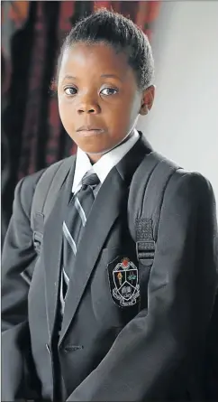  ?? Picture: MARK ANDREWS ?? AT HOME: Zinathi Mfaxa, eight, from King William’s Town, has yet to return to school this year