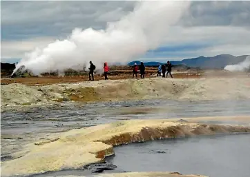  ?? JILL WORRALL ?? Visitors roaming the Hverarond thermal field in northern Iceland.