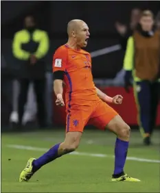  ?? AP PHOTO/PETER DEJONG ?? Netherland’s Arjen Robben celebrates after scoring the second goal during a World Cup Group A soccer qualifying match between the Netherland­s and Sweden at the ArenA stadium in Amsterdam, Netherland­s, on Tuesday.