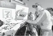  ?? JARED C. TILTON/GETTY IMAGES ?? Joey Logano poses with the winner’s decal in Victory Lane after Sunday’s victory in the Geico 500.