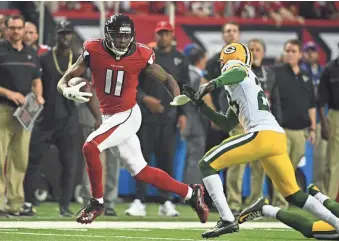  ?? JOHN DAVID MERCER, USA TODAY SPORTS ?? Julio Jones, left, scored two touchdowns as the Falcons routed the Packers 44-21 in the NFC Championsh­ip Game. “He is two steps ahead of you,” said his brother, Phillip Jones.