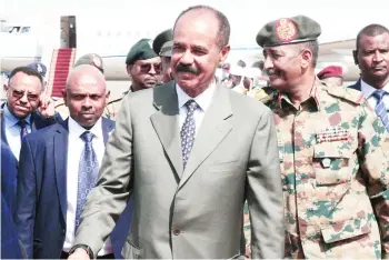  ??  ?? In this file photo taken on Sept 14, 2019 Eritrean President Isaias Afwerki is greeted upon arrival at Khartoum Internatio­nal Airport outside the Sudanese capital. Authoritar­ian and secretive, Isaias Afwerki rose to power by commanding one of Africa’s most remarkable rebel forces during a 30-year struggle for independen­ce from Ethiopia, its much larger neighbour. — AFP photos