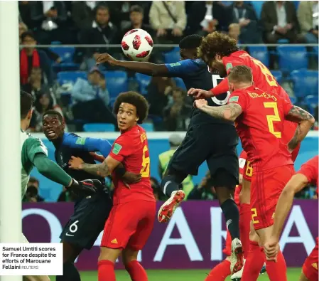  ?? REUTERS ?? Samuel Umtiti scores for France despite the efforts of Marouane Fellaini