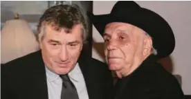  ??  ?? NEW YORK: This file photo taken on January 27, 2005 shows boxer Jake LaMotta and actor Robert De Niro attending a special screening of “Raging Bull” to celebrate it’s 25th anniversar­y and DVD release in New York. LaMotta, the former world middleweig­ht...