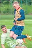  ?? ?? Cumbernaul­d Colts keeper Ryan Adamson makes a double save as Neil Mclaughlin (East Kilbride) misses a penalty