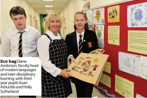  ??  ?? Eco bag Diane Anderson, faculty head of modern languages and inter-disciplina­ry learning, with third year pupils Euan Arbuckle and Holly Sutherland