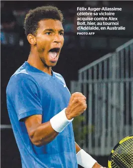  ?? PHOTO AFP ?? Félix Auger-aliassime célèbre sa victoire acquise contre Alex Bolt, hier, au tournoi d’adélaïde, en Australie.