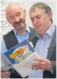  ??  ?? David Lynch and Ken Lynn with the health and social care strategy document.