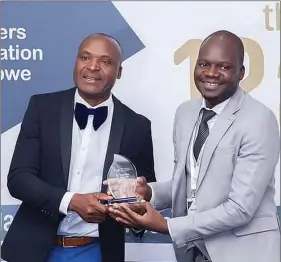  ??  ?? Proton chief sales officer Daniel Chipato (right) receiving the New Product of the Year award