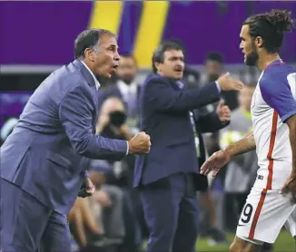  ?? Jeffrey McWhorter/Associated Press ?? Bruce Arena, left, has eight wins and five draws in 13 matches in his current run as coach of the U.S. national team.
