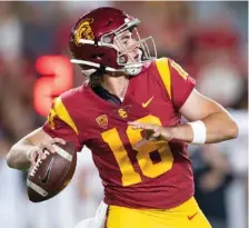  ?? AP FILE PHOTO/ KYUSUNG GONG ?? Quarterbac­k JT Daniels, shown during his time at Southern California, could make his Georgia debut tonight against Mississipp­i State.