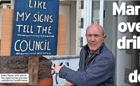  ?? ?? Ewen Taylor with one of the signs he has erected outside his Cardiff home
