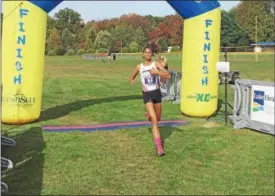  ?? NATE BARNES — THE NEWS-HERALD ?? Chardon’s Denali Selent crosses the finish line to win the Division I Madison District girls race last season.