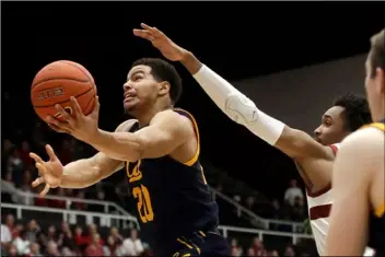  ?? AP FILE PHOTO/JEFF CHIU ?? In this Jan. 2 file photo, California guard Matt Bradley (20) shoots in front of Stanford guard Bryce Wills during the second half of an NCAA college basketball game in Stanford, Calif.