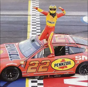  ?? Emilee Chinn / Getty Images ?? Joey Logano celebrates after winning the NASCAR Cup Series Goodyear 400 at Darlington Raceway on Sunday.