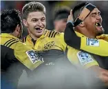  ??  ?? It has been a good year for the Barrett clan. Left, Canterbury’s Jordie Barrett and Scott Barrett with their father Kevin show off the Ranfurly Shield, while Beauden, right, celebrates Super Rugby success with the Hurricanes.