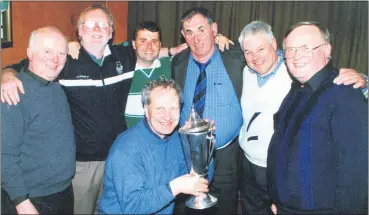  ?? ?? Fr Donal Roberts (with cup) and a band of delighted St Colman’s, Fermoy supporters, savouring the moment after the secondary school were crowned All-Ireland Colleges senior hurling champions, following a win over St Kieran’s College, Kilkenny, l-r: Fr Tony O’Brien, Gus Kelleher, Denis Ring, Mick Dolan, Cllr Frank O’Flynn and Fr Denis Kelleher.