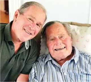  ?? The Associated Press ?? In this photo provided by the Office of George W. Bush, former U.S. presidents George H.W. Bush and his son pose for a photo in Kennebunkp­ort, Maine, Tuesday. Bush enjoyed a relaxing birthday on Tuesday as he became the first former U.S. president to...