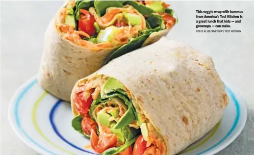  ?? STEVE KLISE/AMERICA’S TEST KITCHEN ?? This veggie wrap with hummus from America’s Test Kitchen is a great lunch that kids — and grownups — can make.