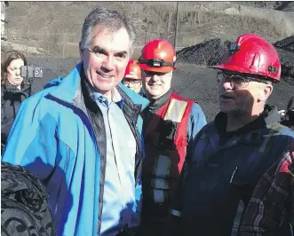  ?? DARCY HENTON/ CALGARY HERALD ?? Conservati­ve Premier Jim Prentice meets with miners in Grande Cache on the second day of the provincial election campaign.