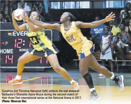  ?? (Photo: Observer file) ?? Sunshine Girl Thristina Harwood (left) collects the ball ahead of Barbados’s Shonette Azore-bruce during the second match of their three-test internatio­nal series at the National Arena in 2017.