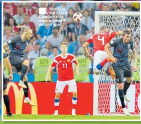  ??  ?? ■LIVING LA VIDA LOCA: Croatia’s Vida rises to head a second goal