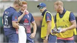  ??  ?? LONDON: England’s Ben Stokes (R) walks on the pitch as England’s David Willey (L) and England’s Jonny Bairstow (2L) take a drinks break during the third One-Day Internatio­nal (ODI) cricket match between England and South Africa at Lord’s Cricket Ground...