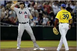  ?? GODOFREDO A. VASQUEZ — THE ASSOCIATED PRESS ?? Mike Trout of the U.S. celebrates after hitting a triple against Colombia during the first inning of a World Baseball Classic game in Phoenix on Wednesday.