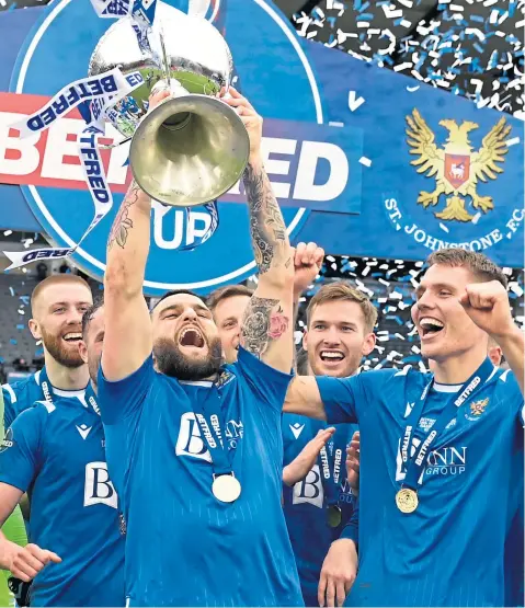  ??  ?? The expression­s say it all as Craig Conway lifts the League Cup back in February, watched by his St Johnstone team-mates