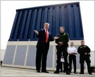  ?? AP PHOTO BY EVAN VUCCI ?? President Donald Trump speaks during a tours as he reviews border wall prototypes, Tuesday, March 13 in San Diego, as Rodney Scott, the Border Patrol’s San Diego sector chief, listens.