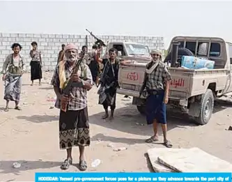  ??  ?? HODEIDAH: Yemeni pro-government forces pose for a picture as they advance towards the port city of Hodeida, controlled by Houthi rebels, during ongoing battles for the control of the city. —AFP