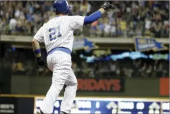  ?? MORRY GASH — THE ASSOCIATED PRESS ?? Milwaukee’s Travis Shaw celebrates after hitting a go-ahead home run off Phillies reliever Joaquin Benoit in the eighth inning Saturday night. The Brewers won, 3-2.