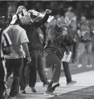  ?? Colin E. Braley / Associated Press ?? Baylor coach Dave Aranda, right, reacts in a win over Kansas State on Saturday. With a win over Tech and an Oklahoma State win over Oklahoma, the Bears would make the Big 12 title game.