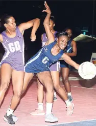  ?? COLLIN REID PHOTOS ?? Racers’ centre Quania Walker (right) makes a desperate lunge for ball between Orchids pair of defenders Shanique McFarlane (left) and Kimberly Thomas (partly hidden)