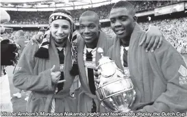  ??  ?? Vitesse Arnhem’s Marvelous Nakamba (right) and teammates display the Dutch Cup