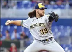  ?? JIM RASSOL / AP FILE ?? Brewers pitcher Corbin Burnes, a Centennial High graduate, tossed seven shutout innings on Sunday in an 8-0 win over the Cardinals.